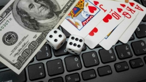 online casino sign up bonus Money, dice and cards on laptop keyboard