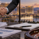 Editorial illustration of a casino takeover proposal, legal documents, and a Las Vegas gaming company