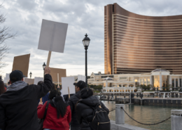 Editorial illustration for Encore Boston Harbor Strike Reaches Day 40 as Contract Talks Continue